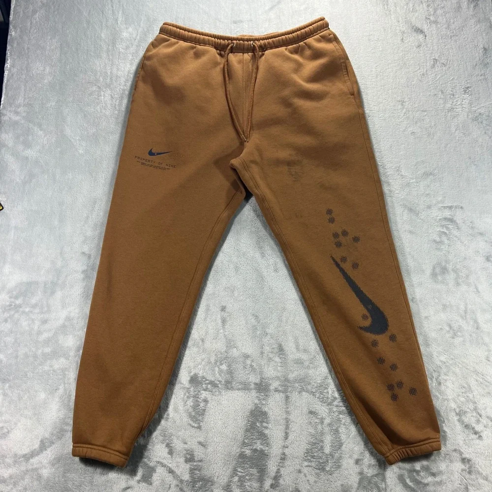NIKE Sportswear Club Cuffed Fleece Pants Mens Large Brown IM7828-235 Graphic